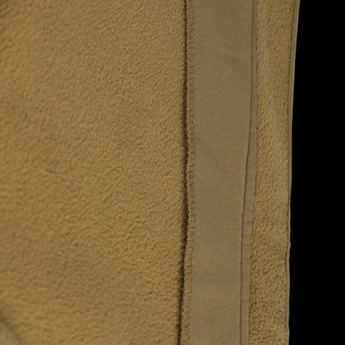Close-up of the tan fleece fabric and vertical seam on the Condor Westpac Softshell Jacket, commonly used in Military and First Responder apparel.